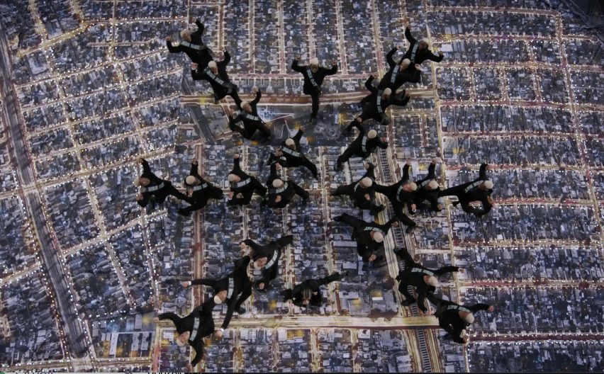 Dancers perform on a floor designed by Es Devlin