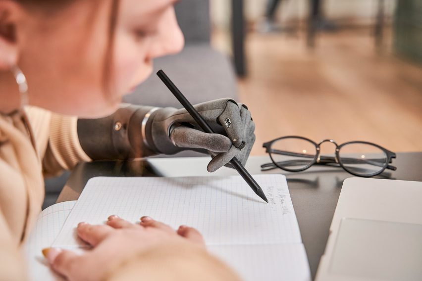 A woman drawing with an Esper Bionics arm