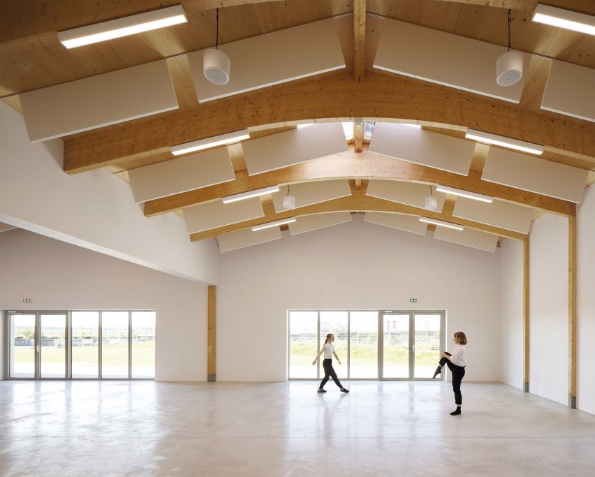 Multipurpose hall with exposed timber structure
