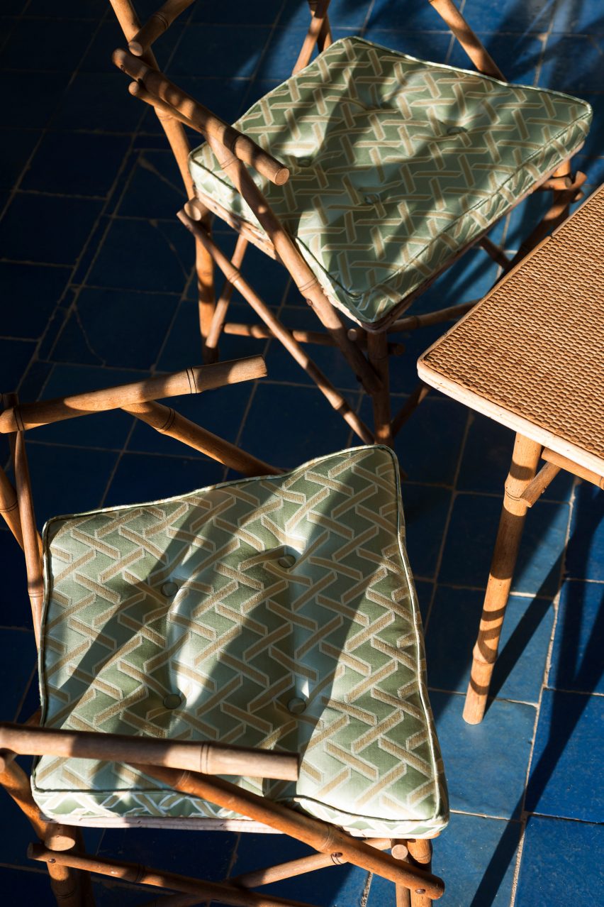 Volver Geometric pattern fabric by Dedar used on cushions on wooden chairs