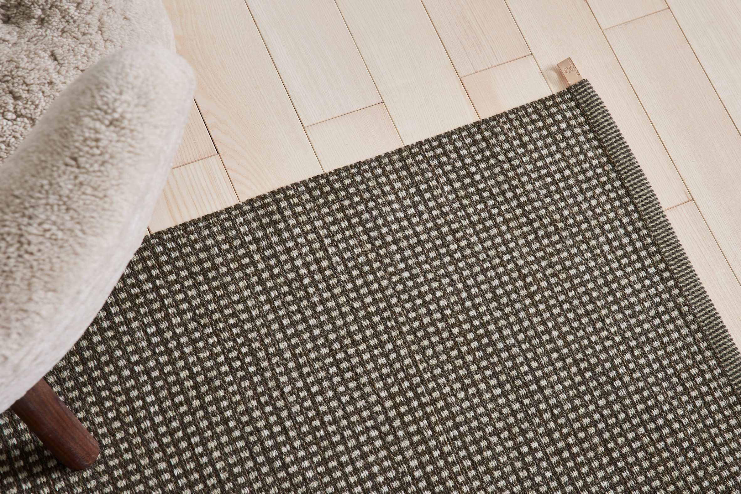 Häggå Dot Icon rug in Raw Umber by Kasthall