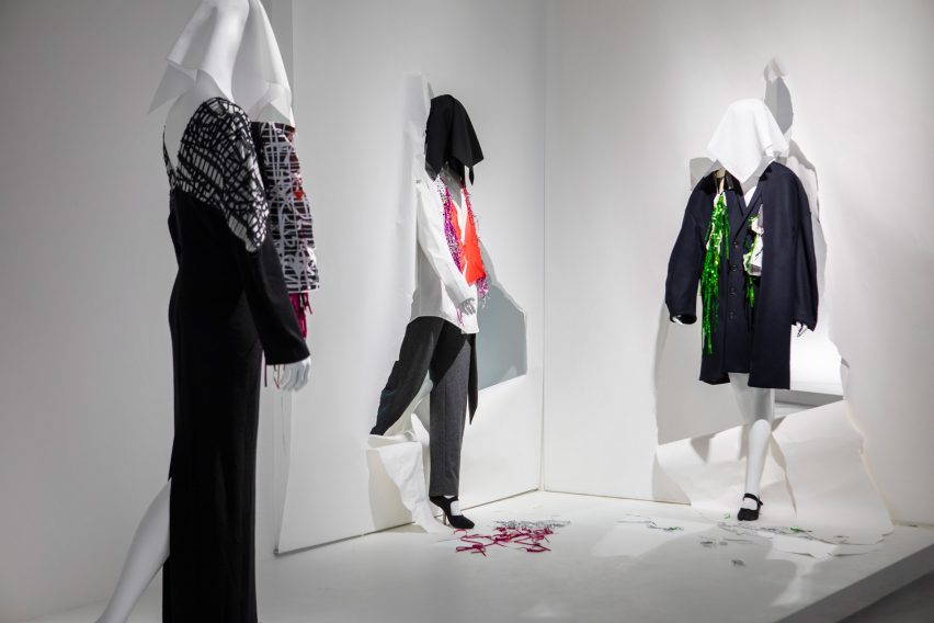 Mannequins rip through paper walls at the Chalayan exhibition 