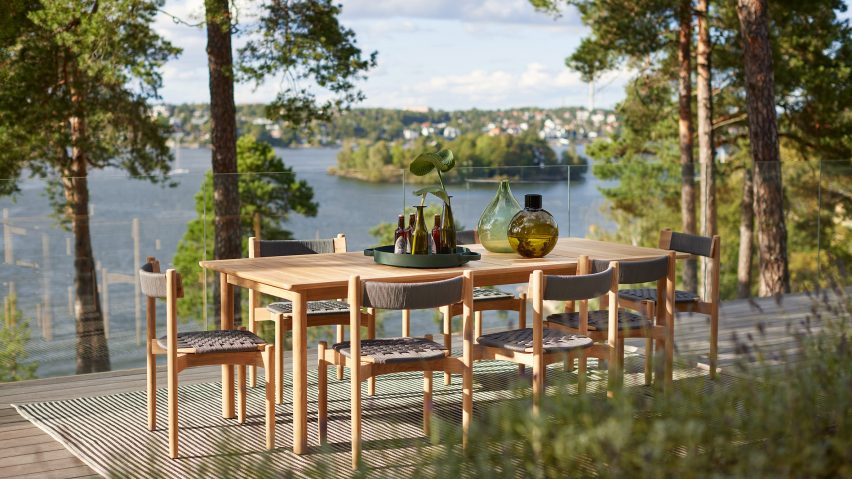 Long dining table and chairs from Koster outdoor collection by Studio Norrlandet for Skargaarden on a patio