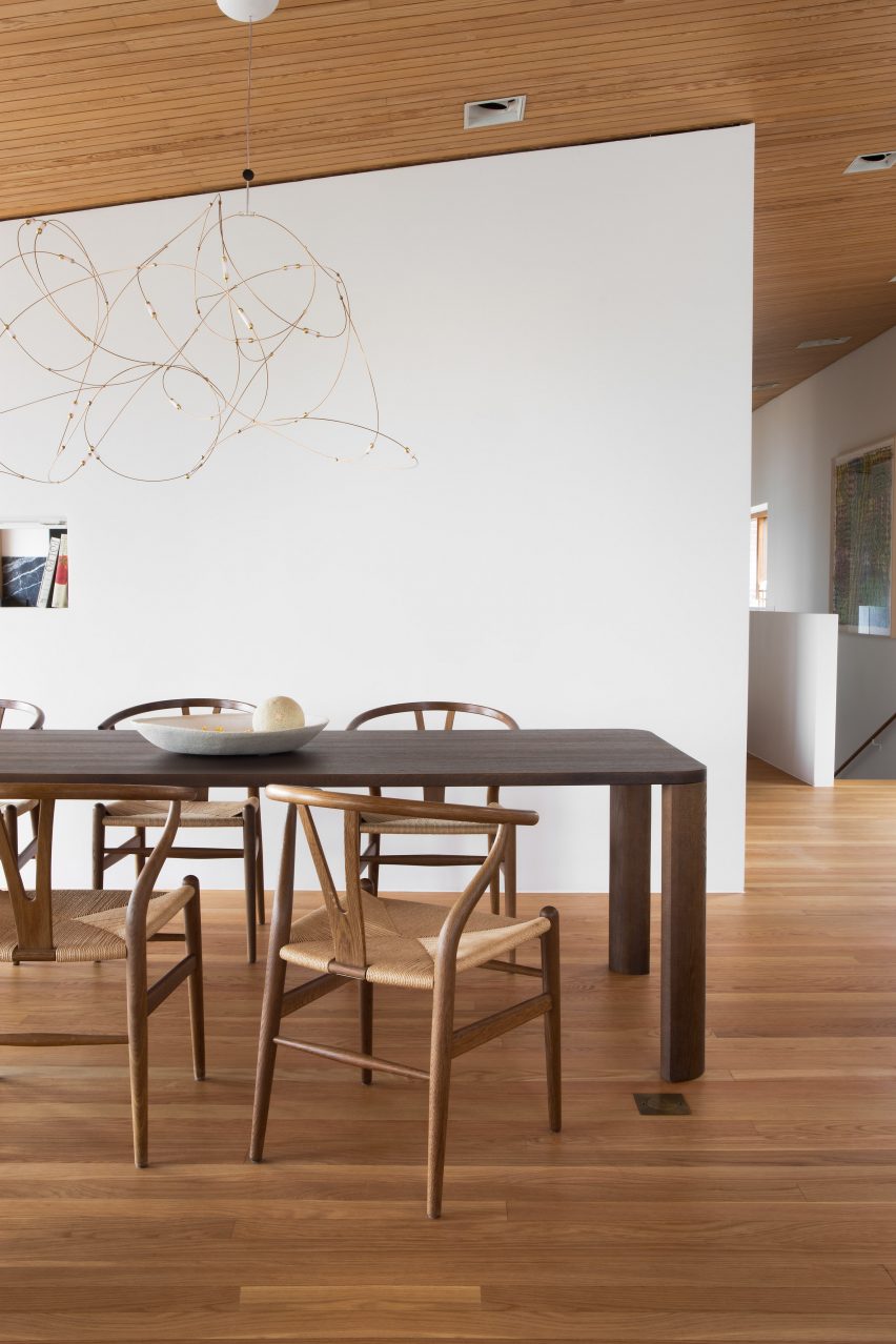 A photograph of the dark brown wooden Moci dining table by Moa Sjöberg for Asplund