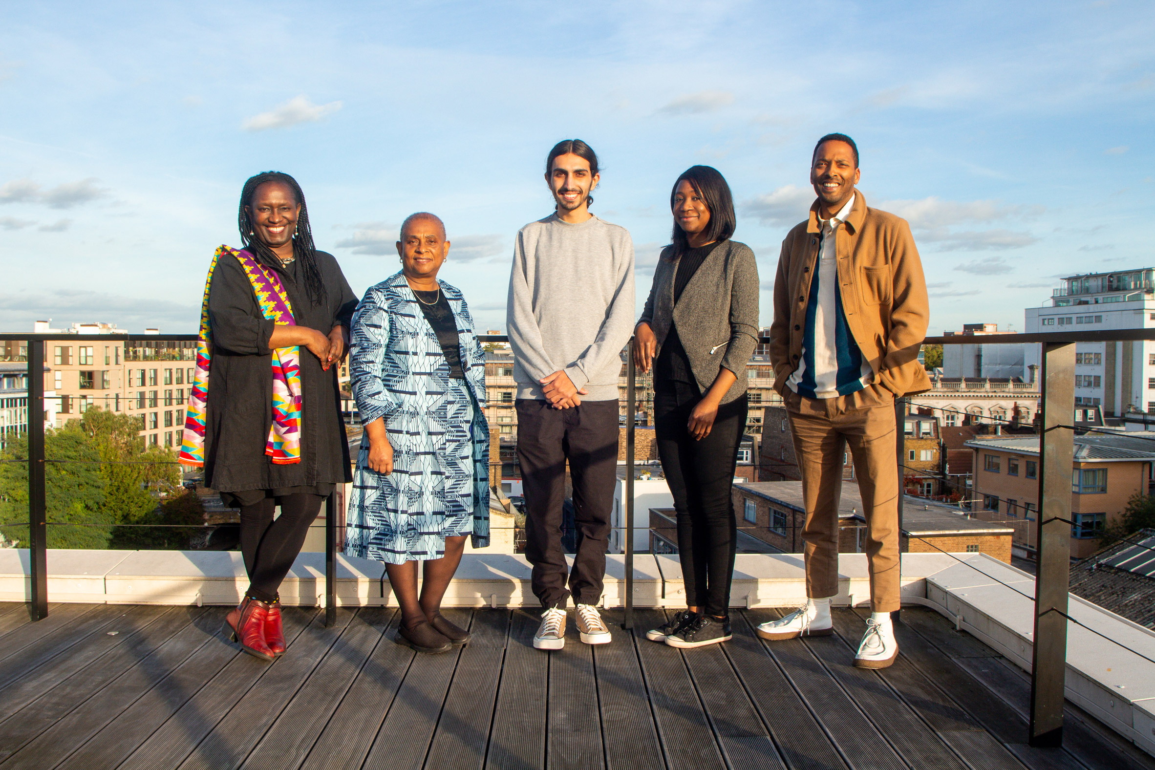 Elsie Owusu, Doreen Lawrence, two architecture students and Neal Shasore on a rooftop