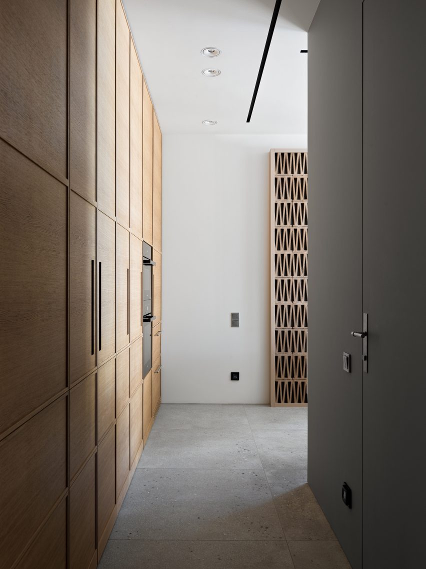 Wooden cupboards along a hallway