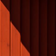 Red-painted wood cladding