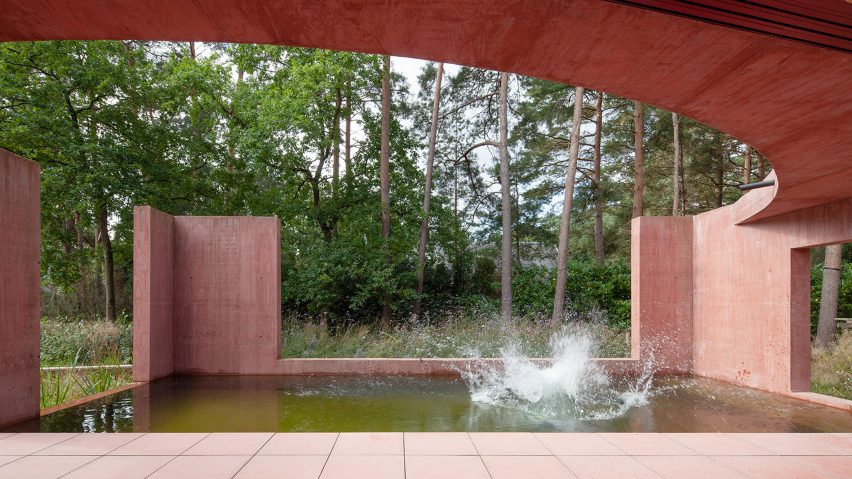 The patio and swimming pond of the Refuge with curved roof overhead
