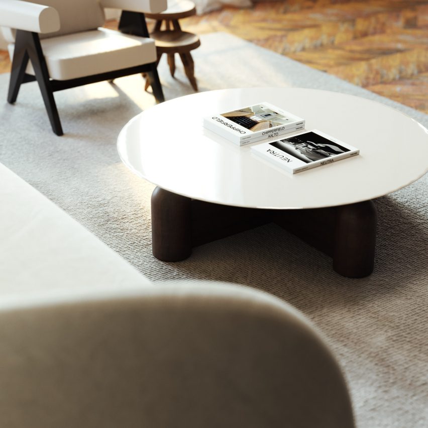 Aerial view of coffee table with circular glossy white top and dark wooden base
