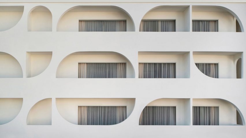 Arch windows punctuate Sumei Skyline Coast hotel by GS Design