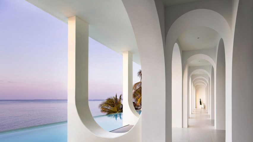 Arches running along the infinity pool at the Sumei Skyline Coast hotel by GS Design