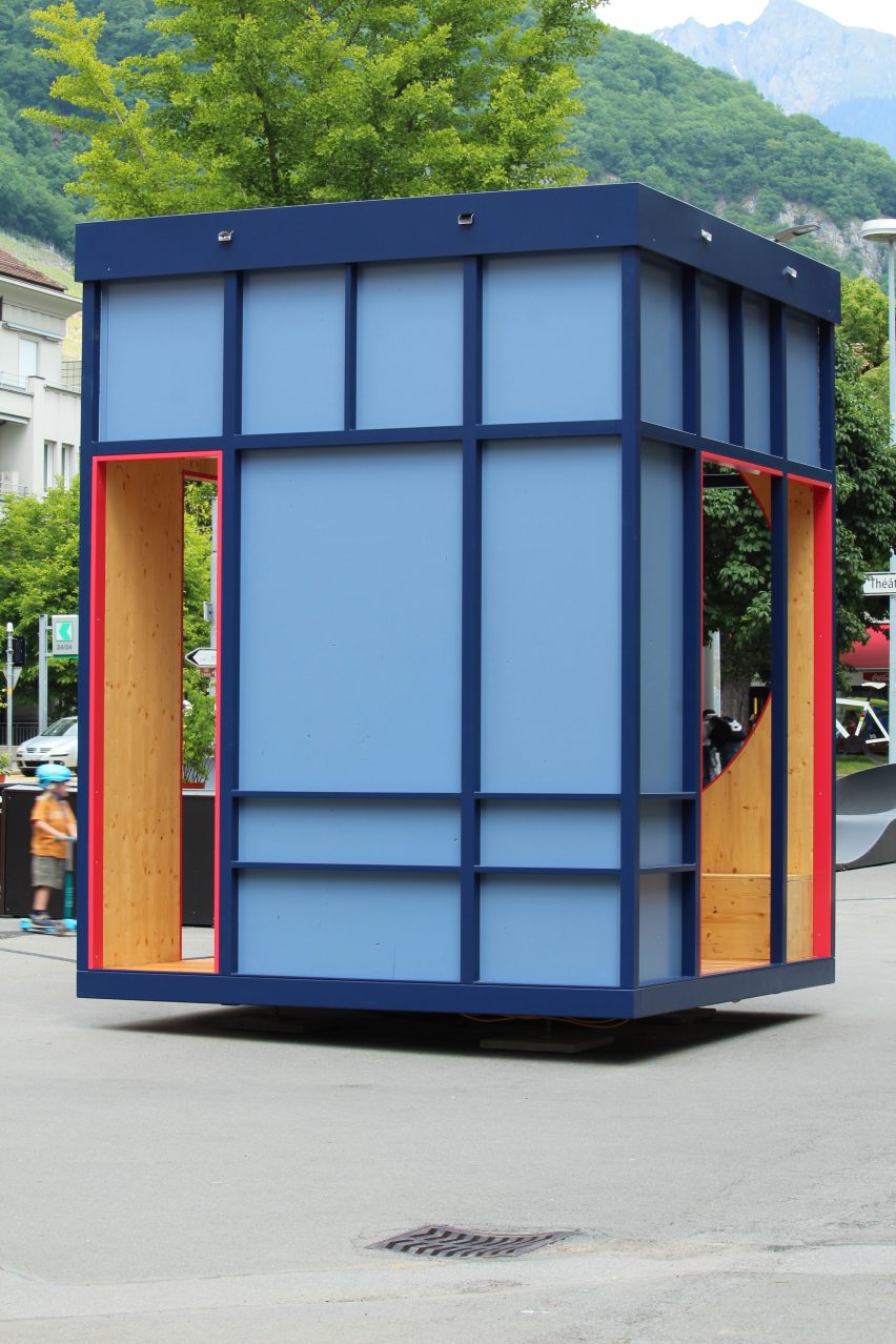 A blue pavilion in a public square