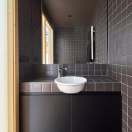 Black-tiled bathroom