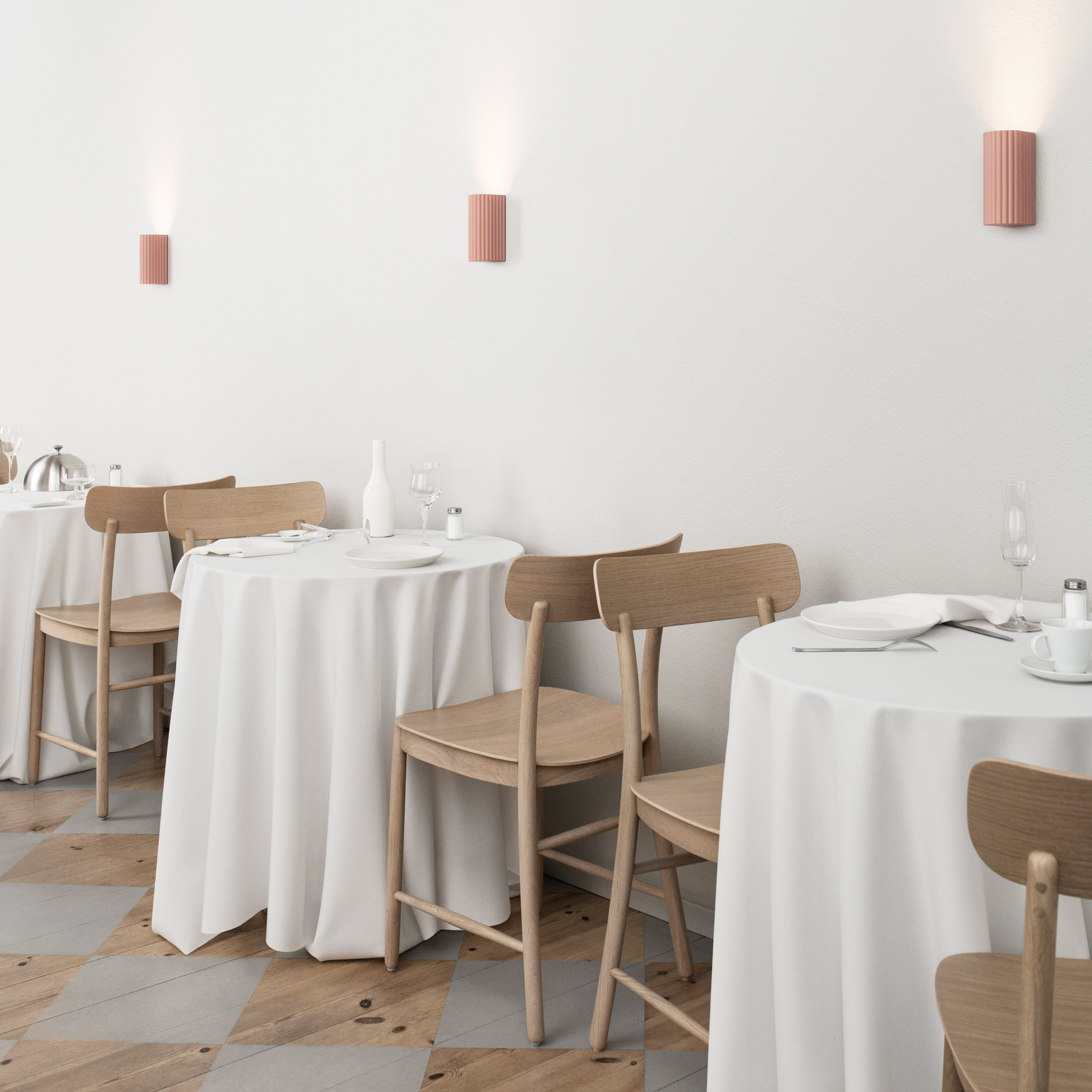 Pink Donna wall lights in a white restaurant with wooden chairs