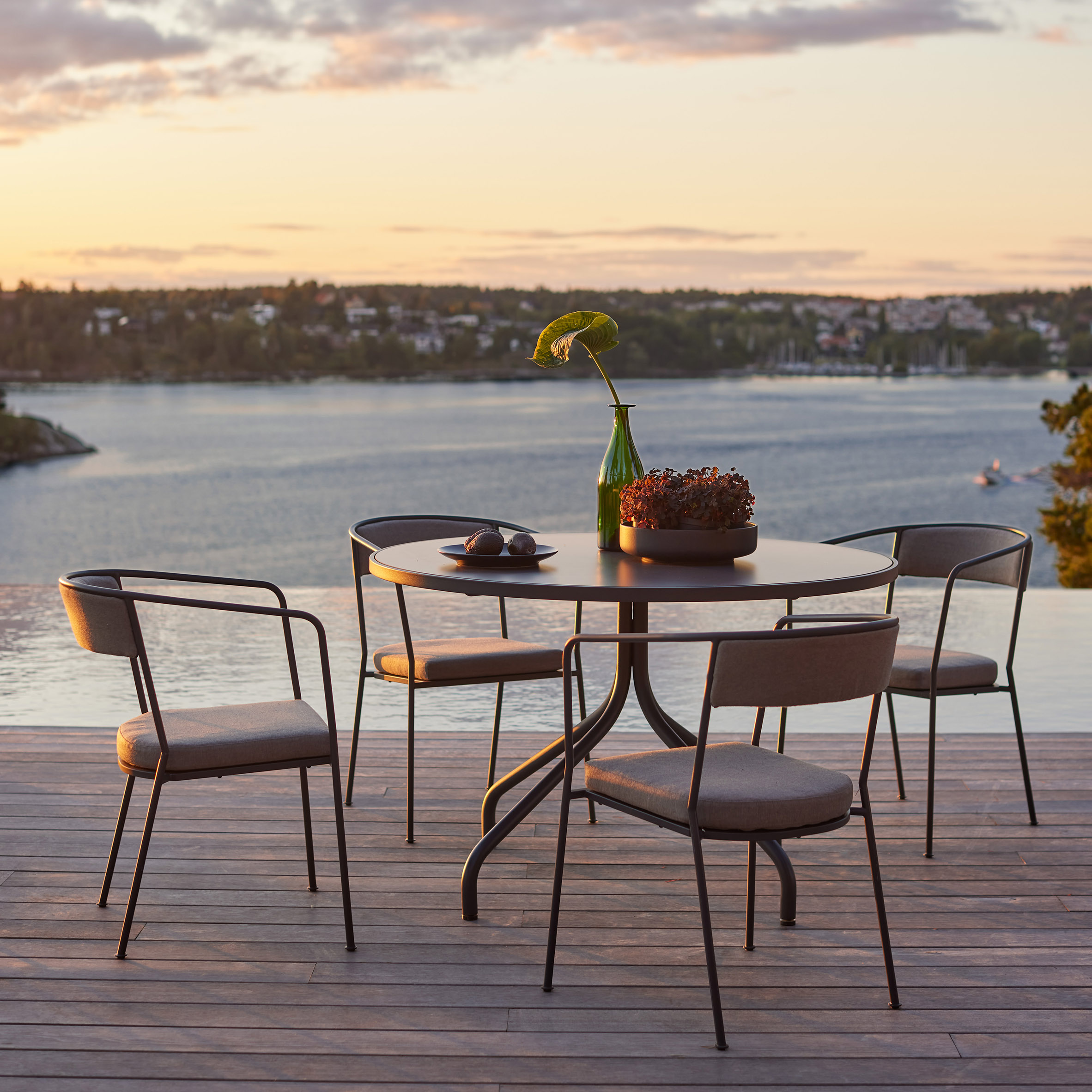 Arholma outdoor table and four chairs on decking