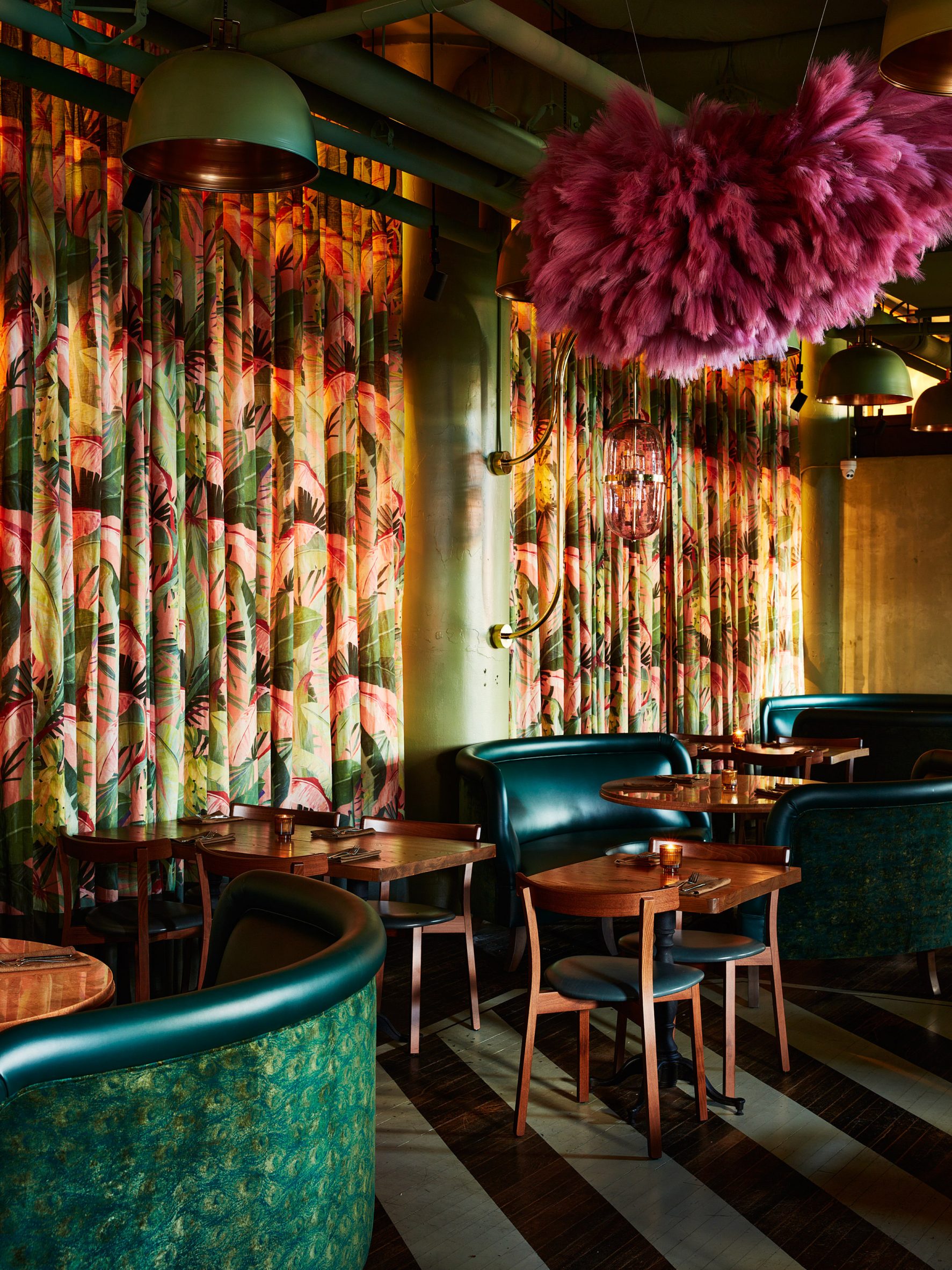Tropical curtains and pink floral installations