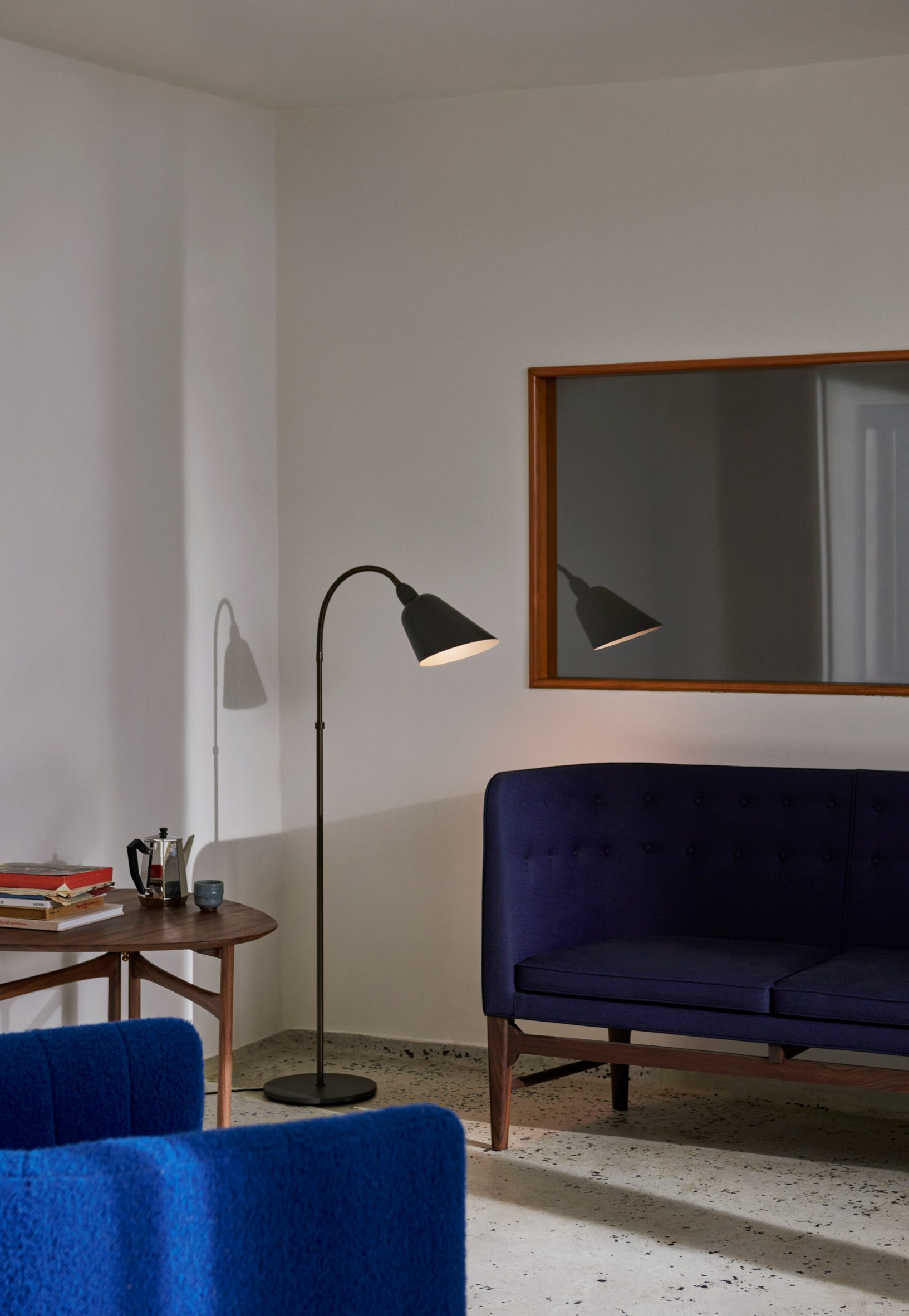 Steel grey Bellevue floor lamp in a cream living room with blue sofas
