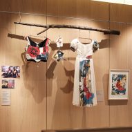 Clothing by Bethany Williams is hung from branches