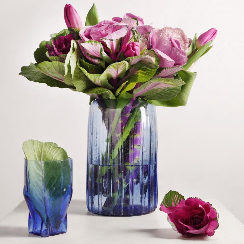Navy vase and tumbler from the Phoenician collection by Beit Collective with pink flowers in