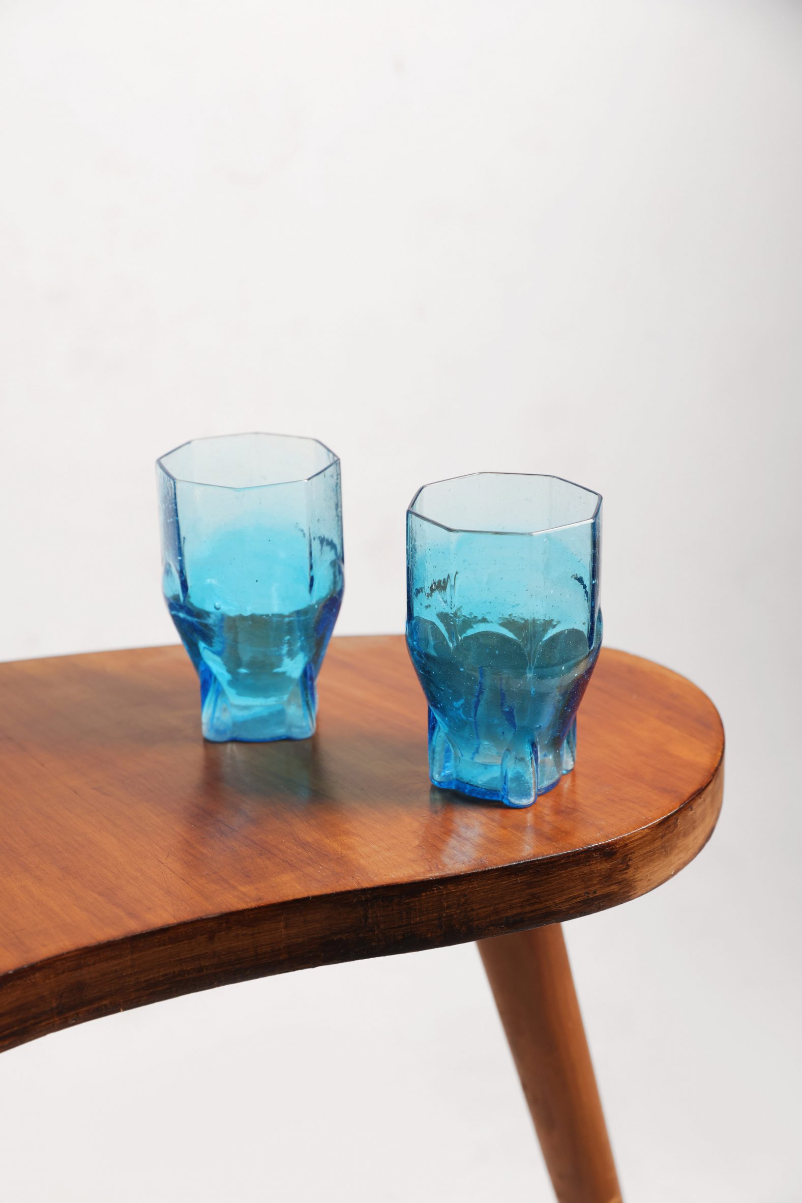 Two drinking glasses on a table