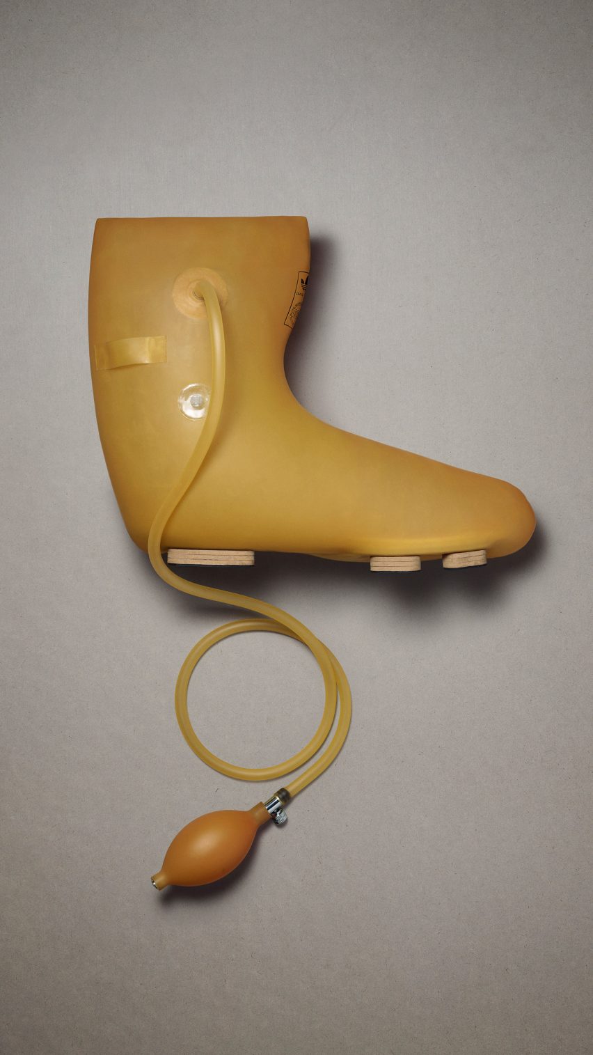 A yellow boot with a pump attached