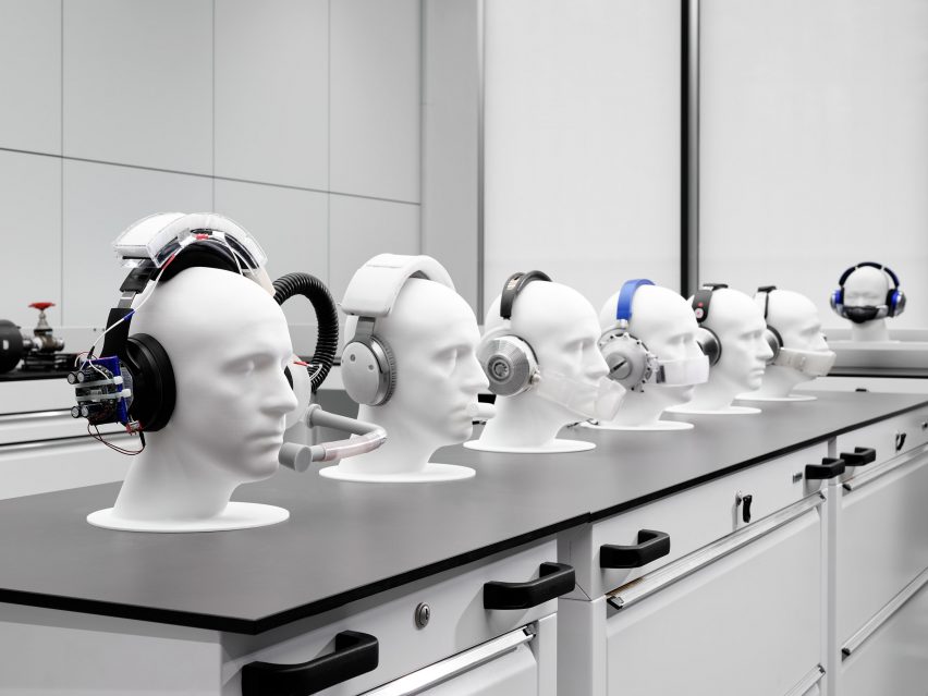 A row of mannequins wearing Dyson headphones