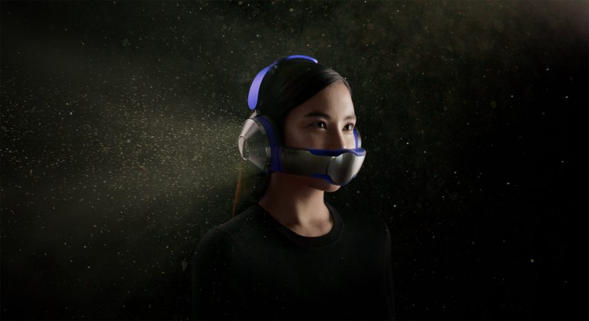 A woman wearing a Dyson Zone visor and headphones
