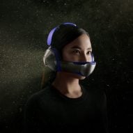 A woman modelling Dyson Zone headphones