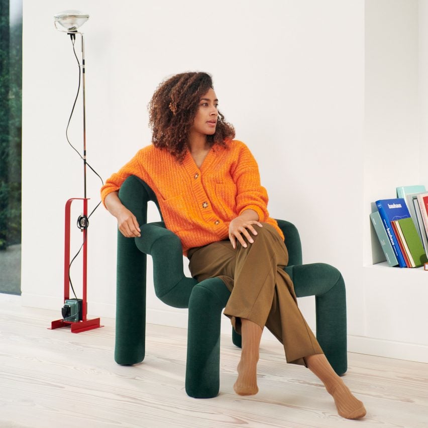 Green Ekstrem chair by Varier with a woman sitting in it