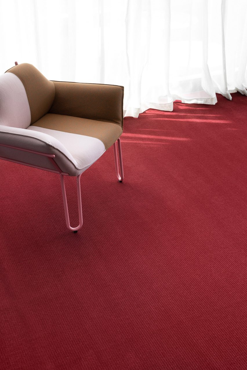 A photograph of a woven red carpet by Signature Floors