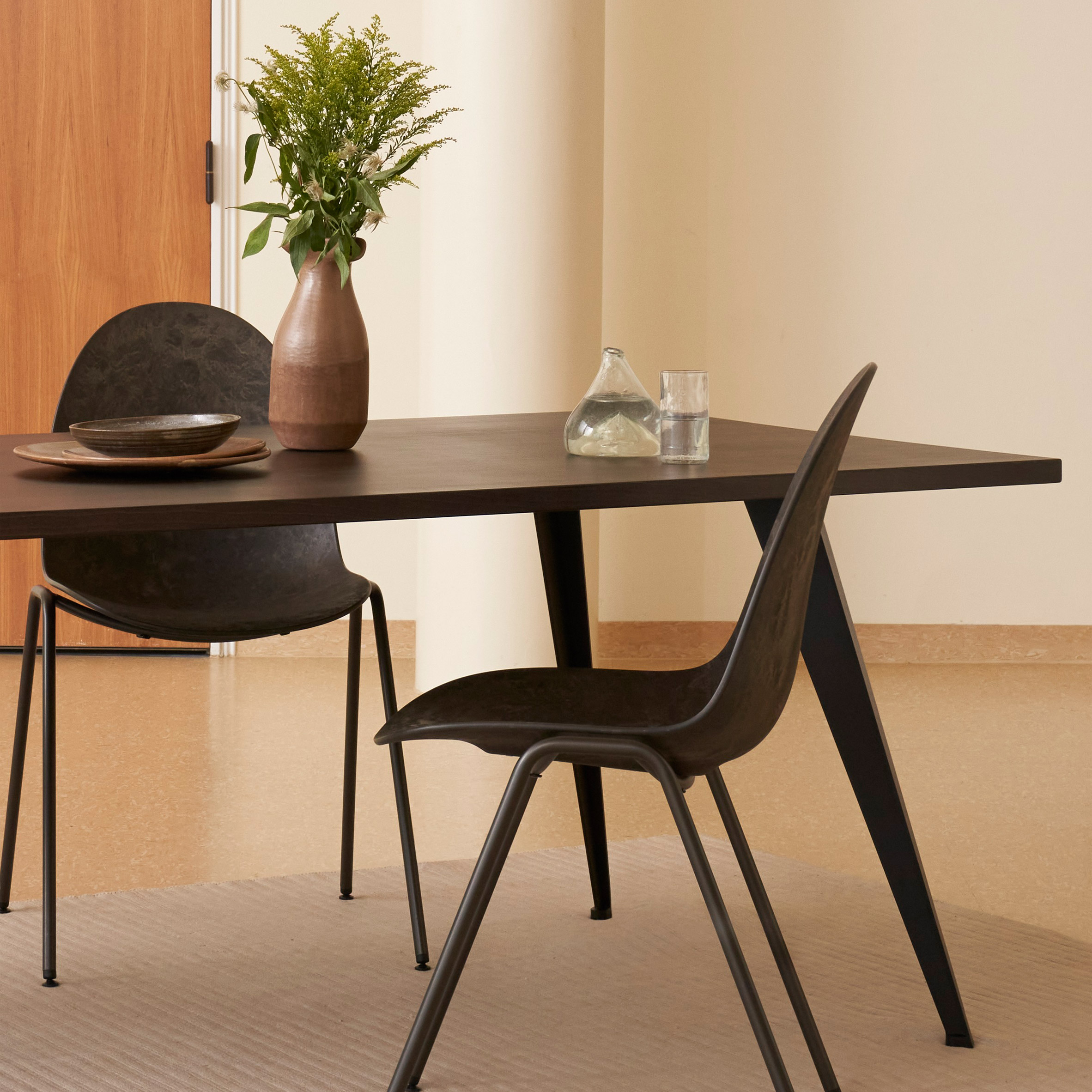 Two Eternity chairs by Space Copenhagen for Mater at a dining table