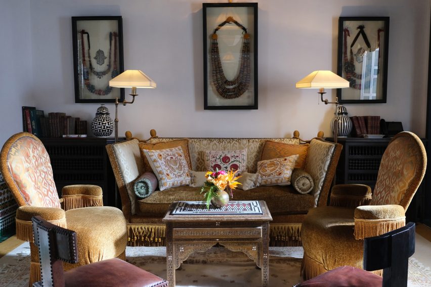 A living room with golden furniture