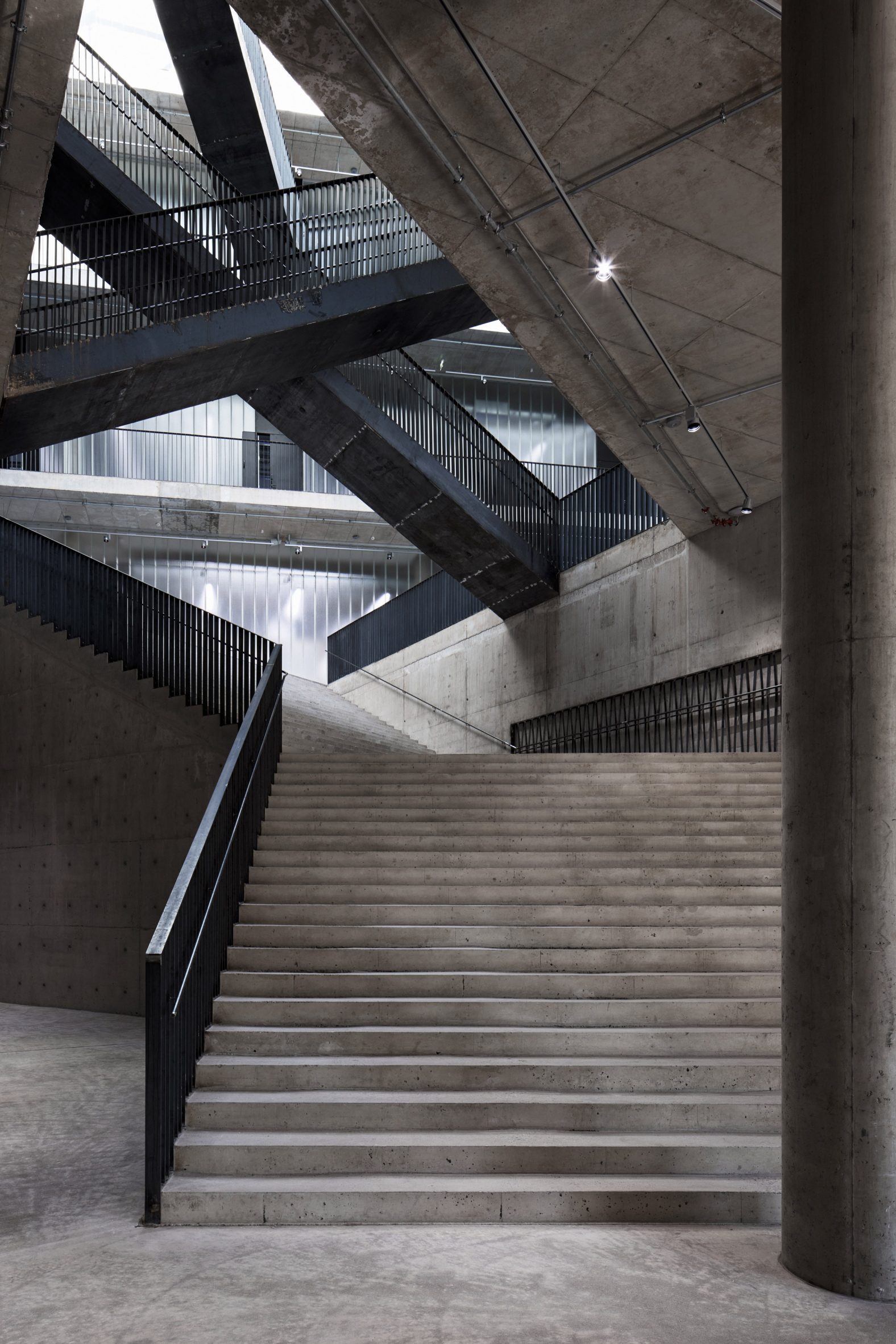 Concrete staircases overlap and cross each other at University of the Arts Helsinki