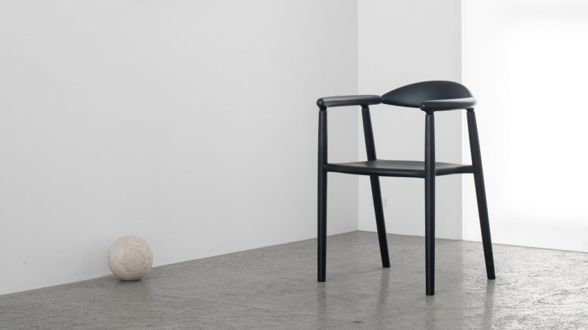 Musubi Armchair pictured on top of a concrete floor