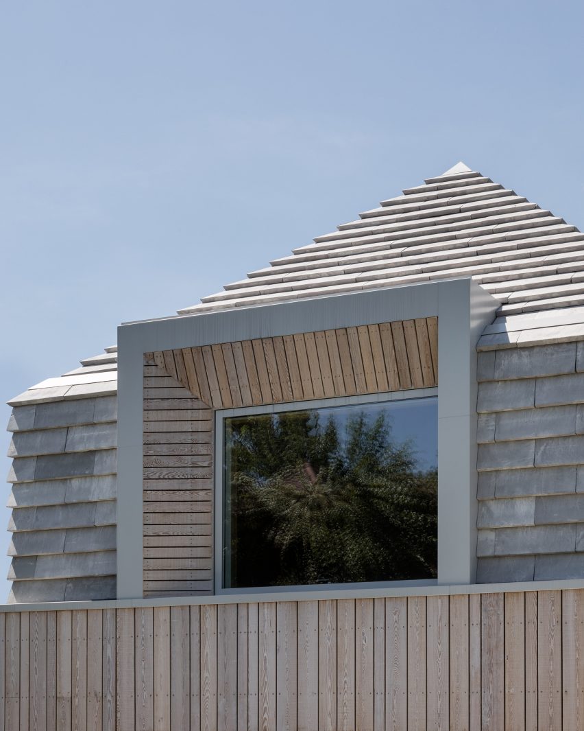 Detail image of the roof extension and protruding window at Hipped House