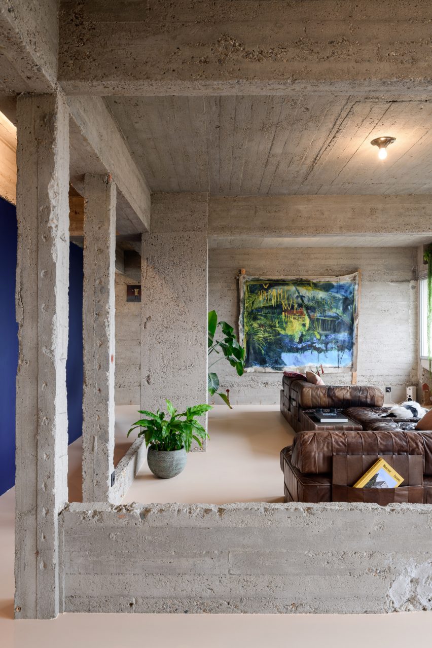 Living room with exposed concrete walls