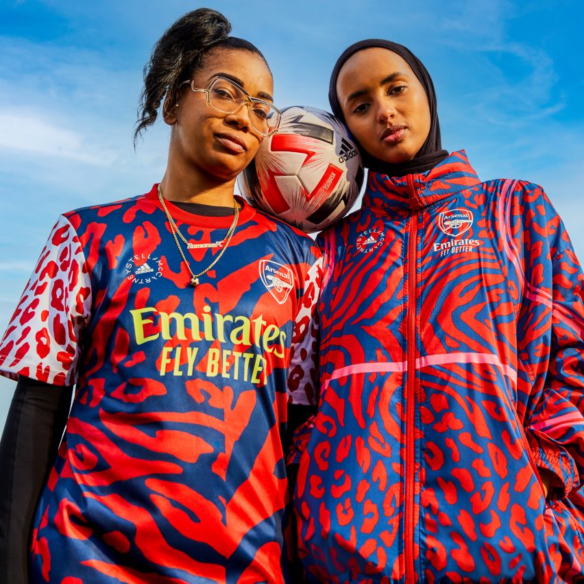 Two female footballers modelling Adidas football kits