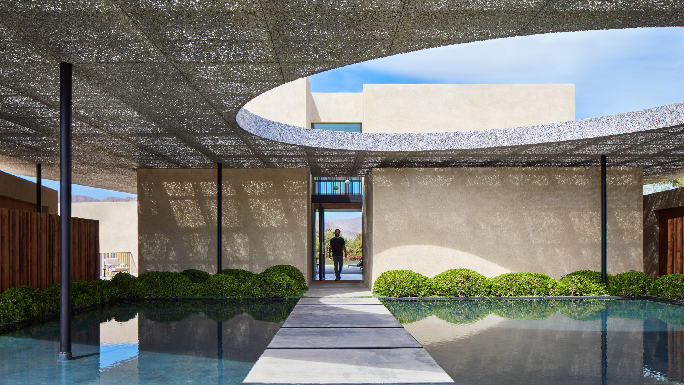 Mesh canopy shades California desert retreat by Kovac Design Studio