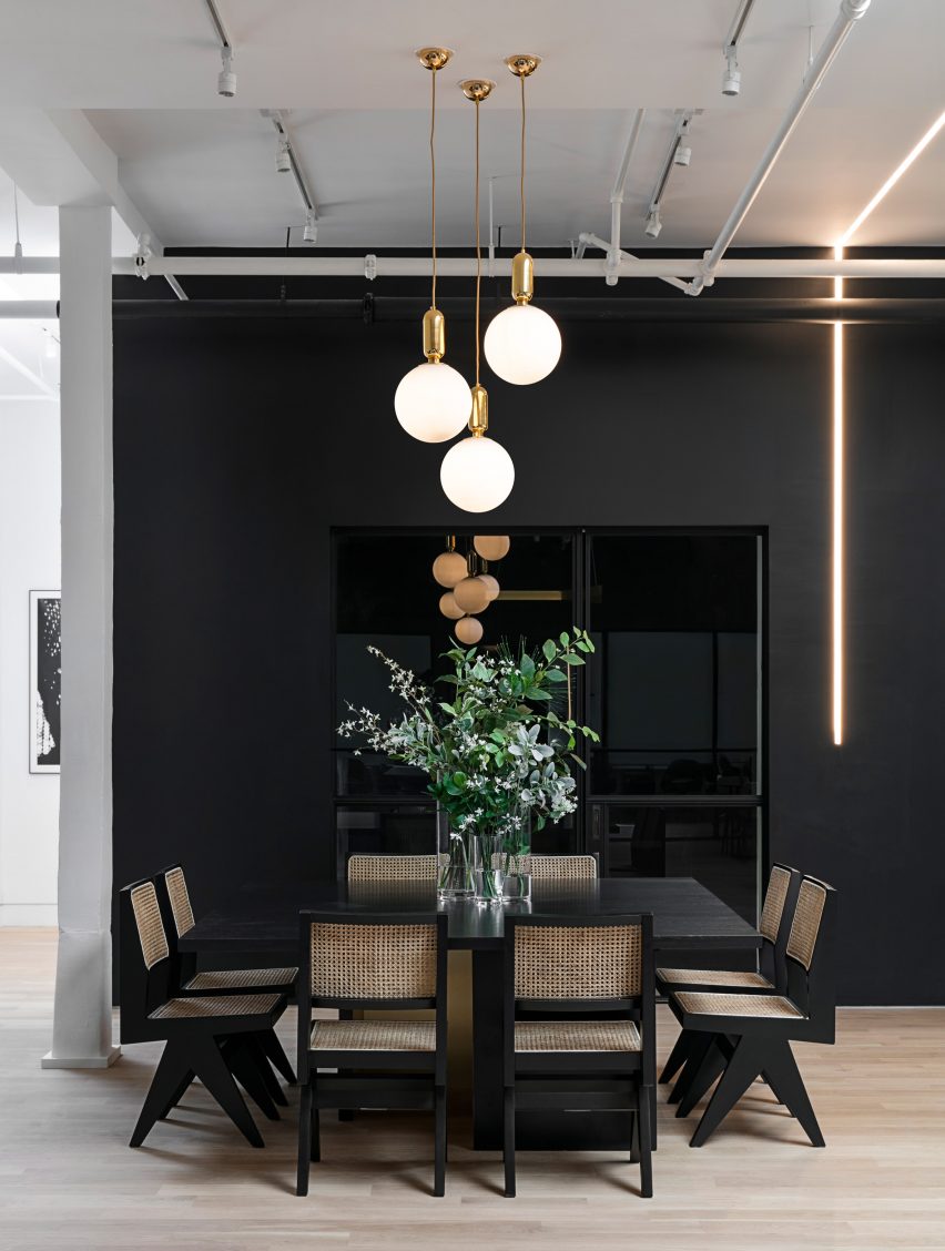 Meeting table against black wall