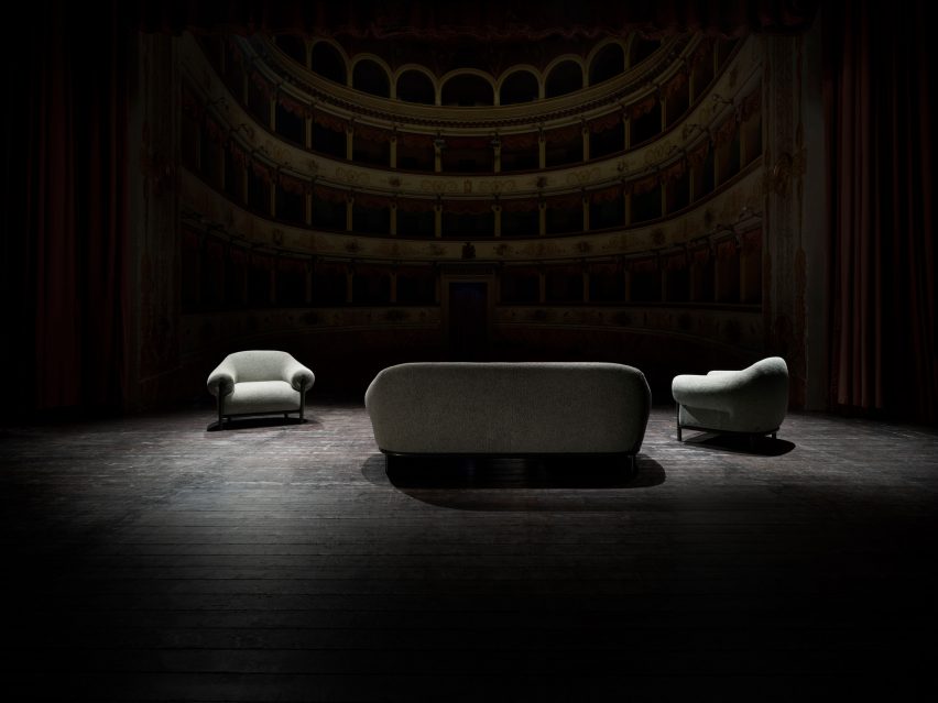 Fender sofa and two armchairs on a theatre stage with spot lighting