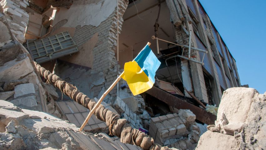 Ukraine flag in rubble