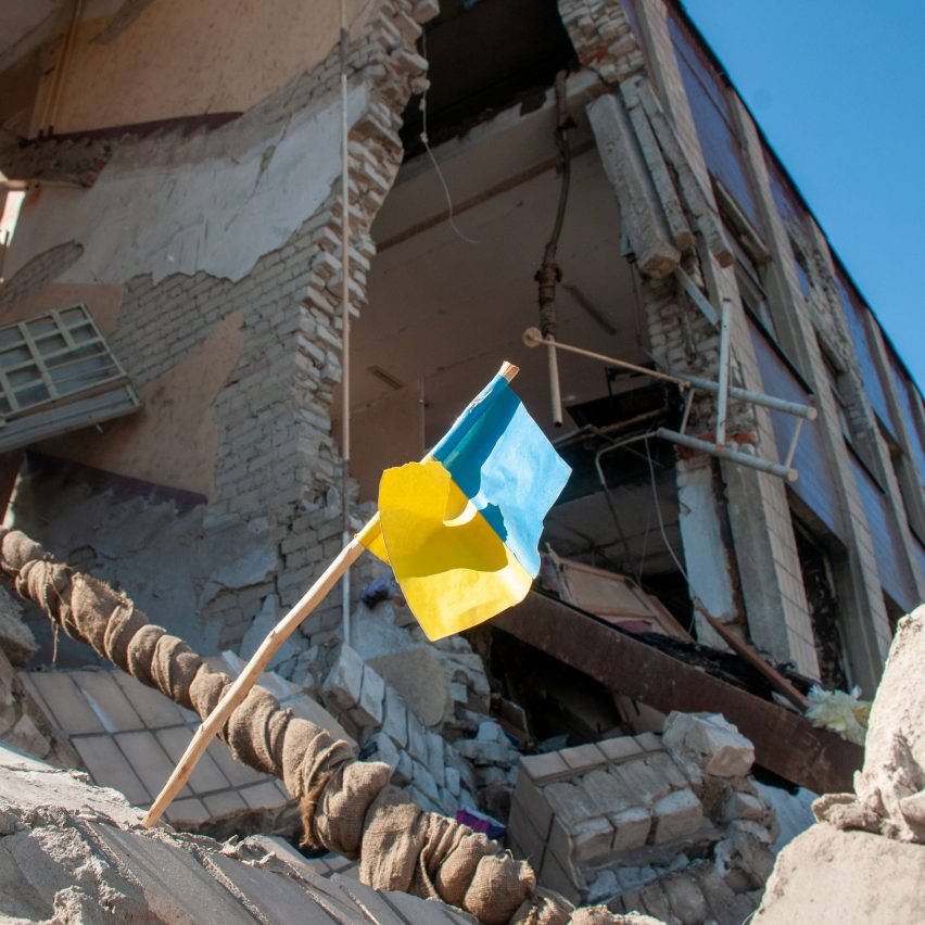 Ukrainian flag in rubble