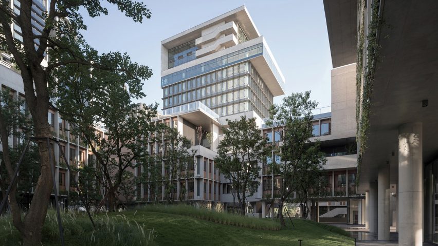 Image of the office building from a tree-filled courtyard