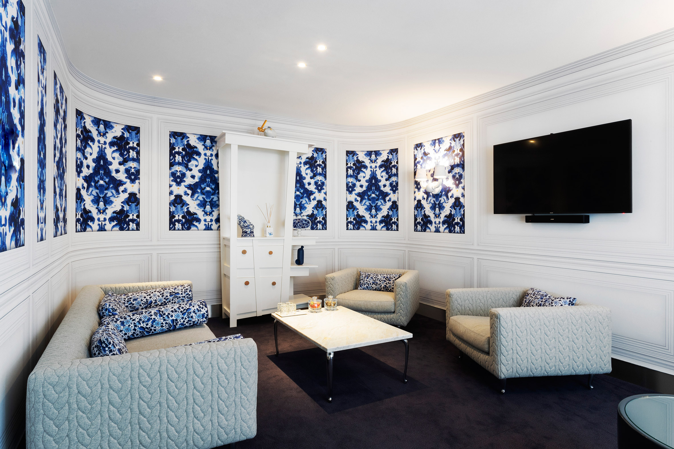 Blue-and-white room in airport lounge designed by Marcel Wanders