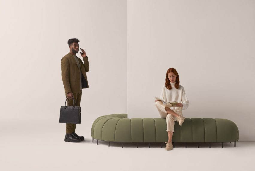 Green upholstered Worm chair pictured in use