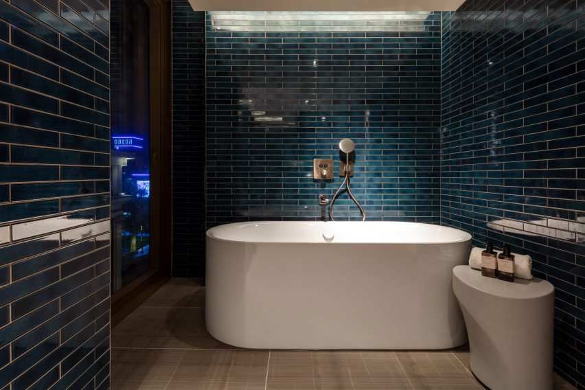 A photograph of a blue bathroom in The Londoner 