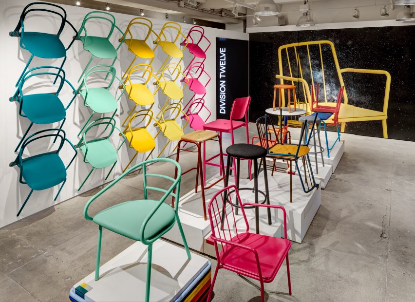 A photograph of Divison Twelve's colourful Catty chair, which is stacked up on a wall