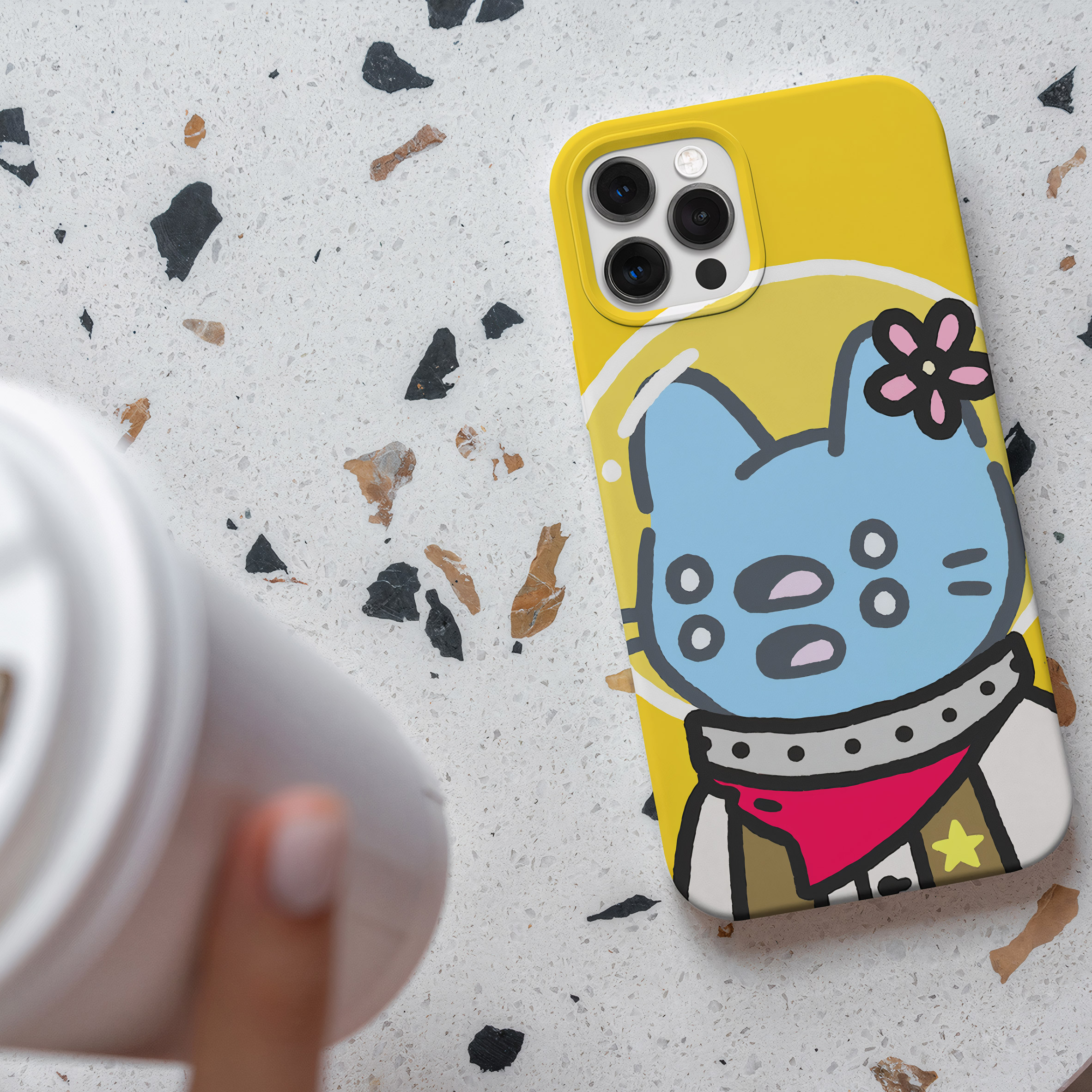 A photograph of a phone case which has a cartoon on its cover