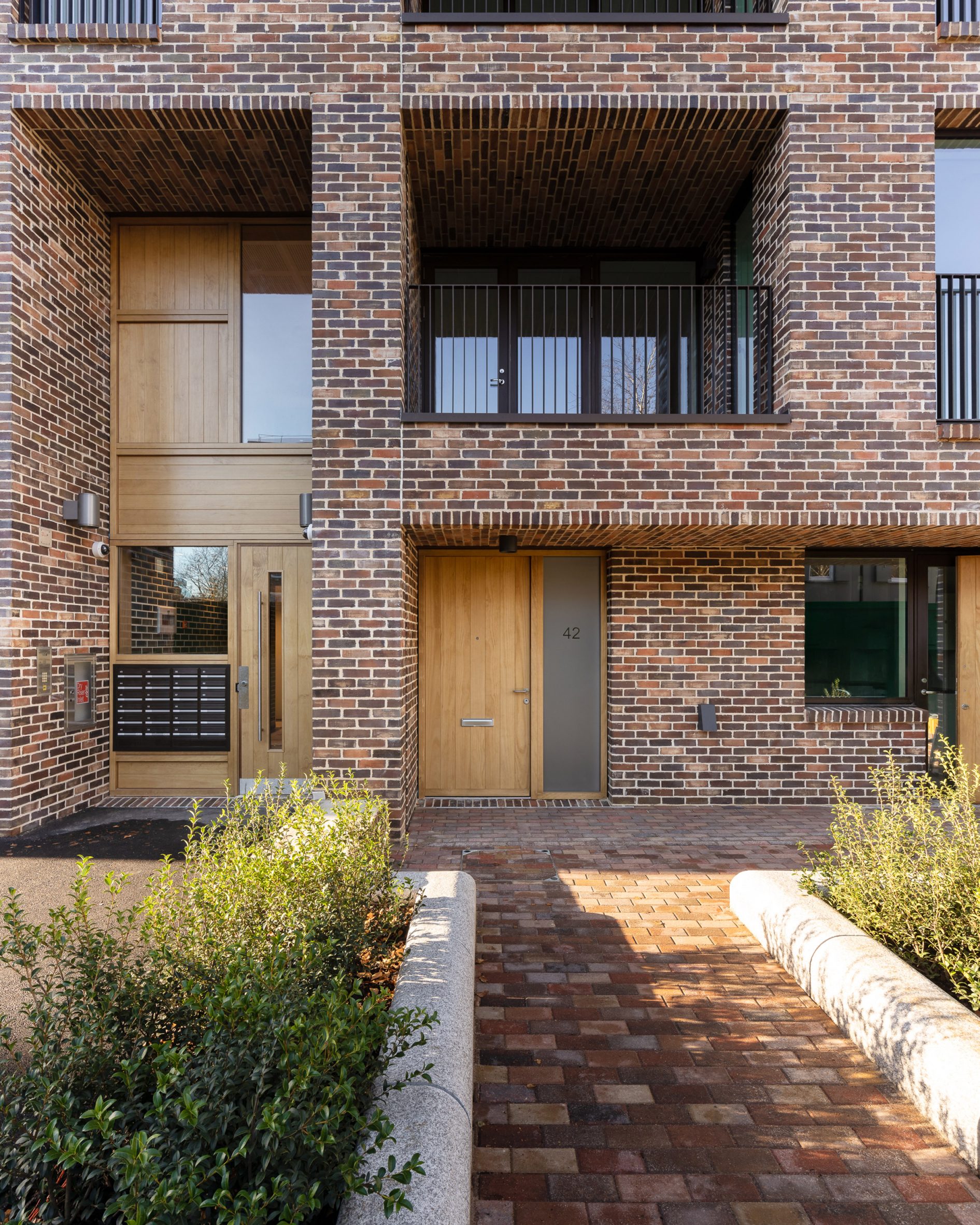 Brick exterior of a residence in Karakusevic Carson Architects' Colville Estate