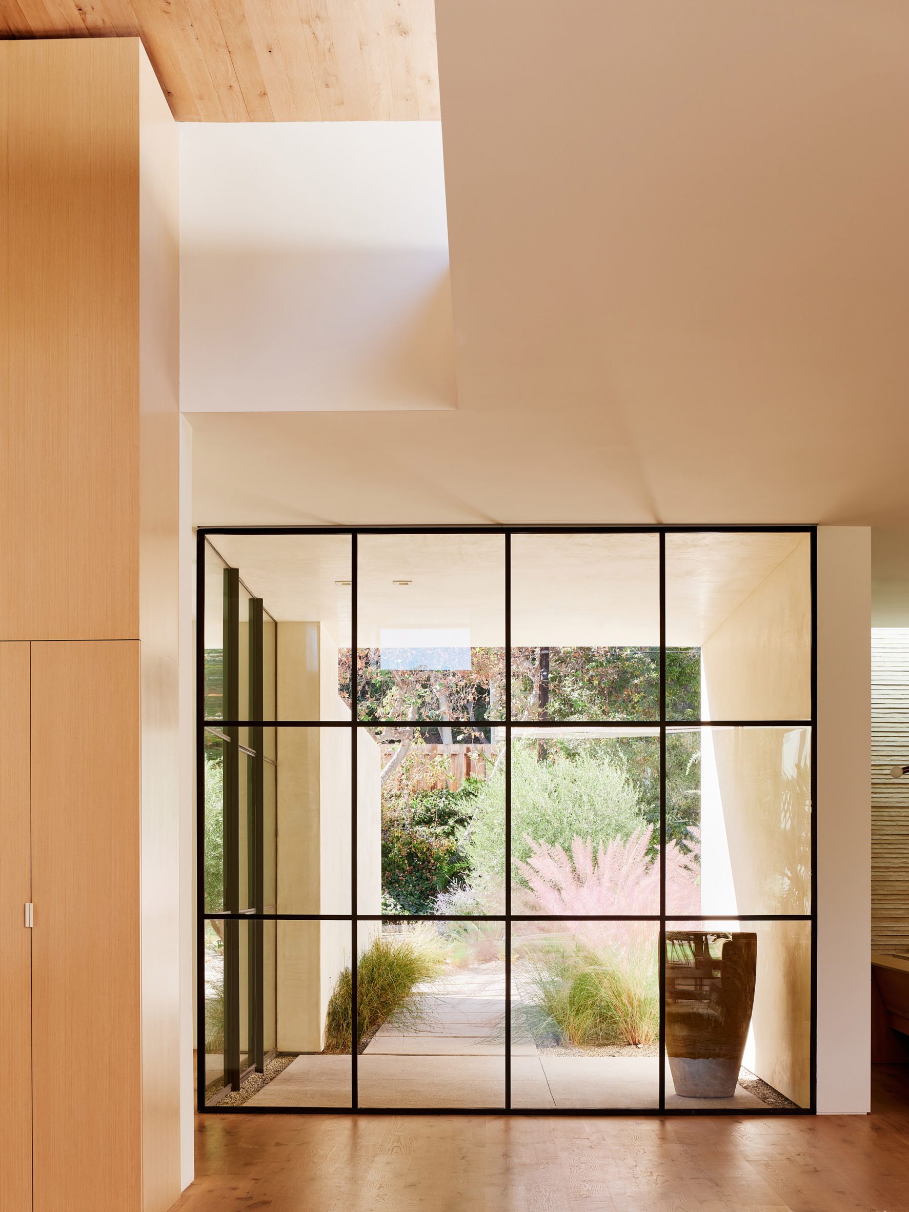 glass windows and stucco and wood ceiling